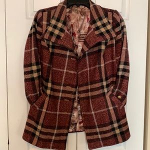 This is a hand tailored, wool, Burberry weave jacket. Size medium.